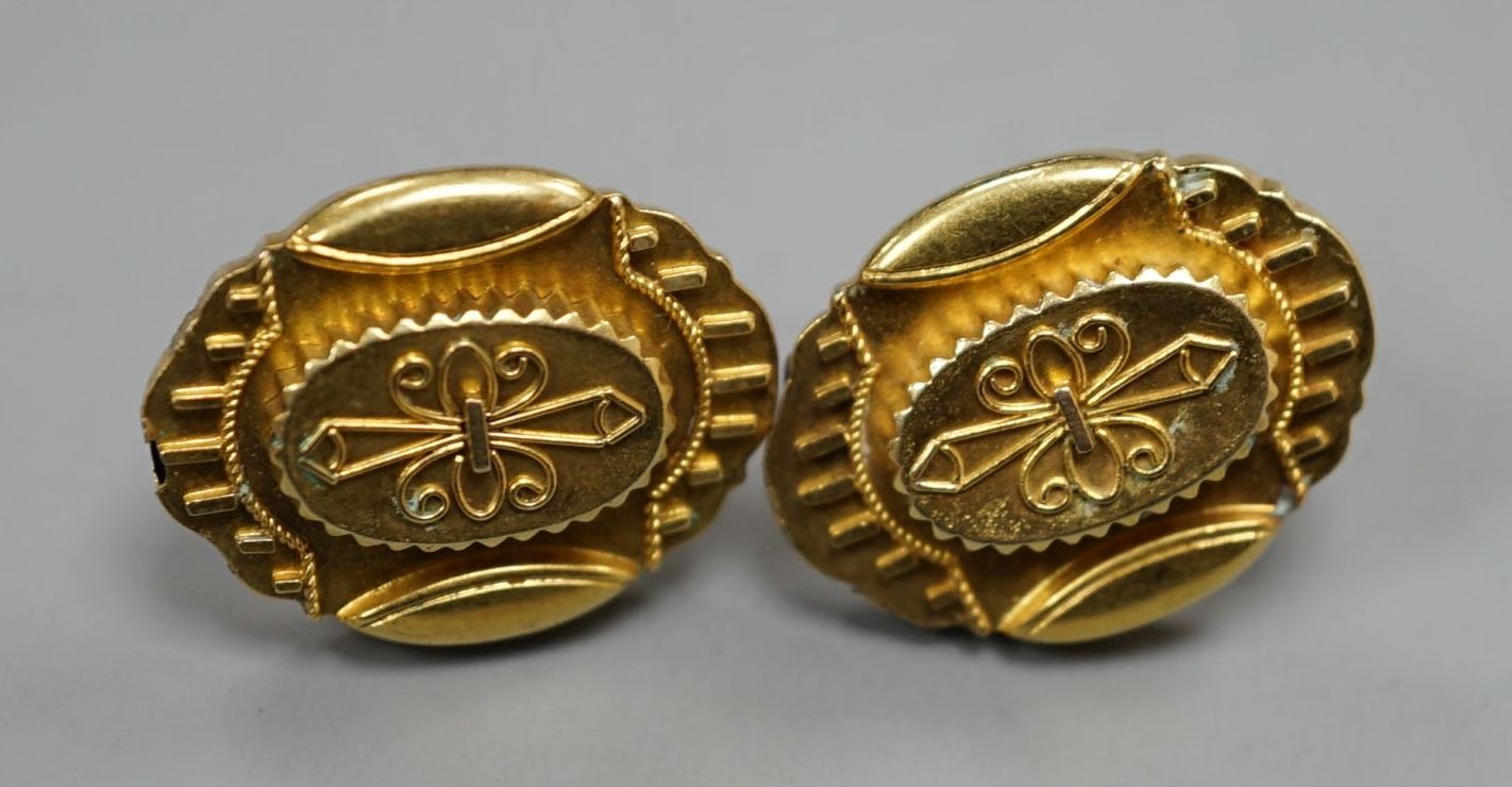 A pair of Victorian yellow metal ovoid ear studs(a.f.), 5 grams.